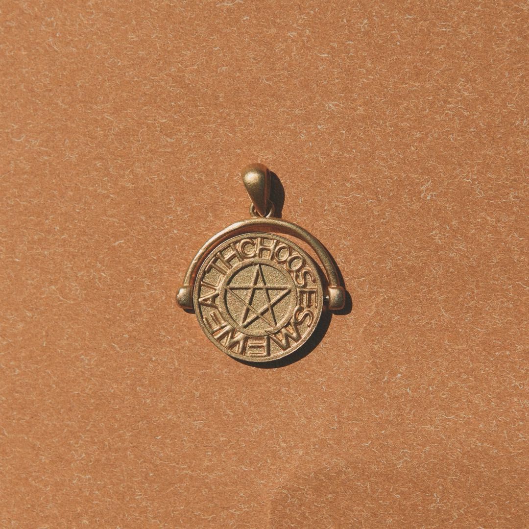 Yiru.jewellery pentacle signet pendant with engraved pentagram design on a sleek silver chain.