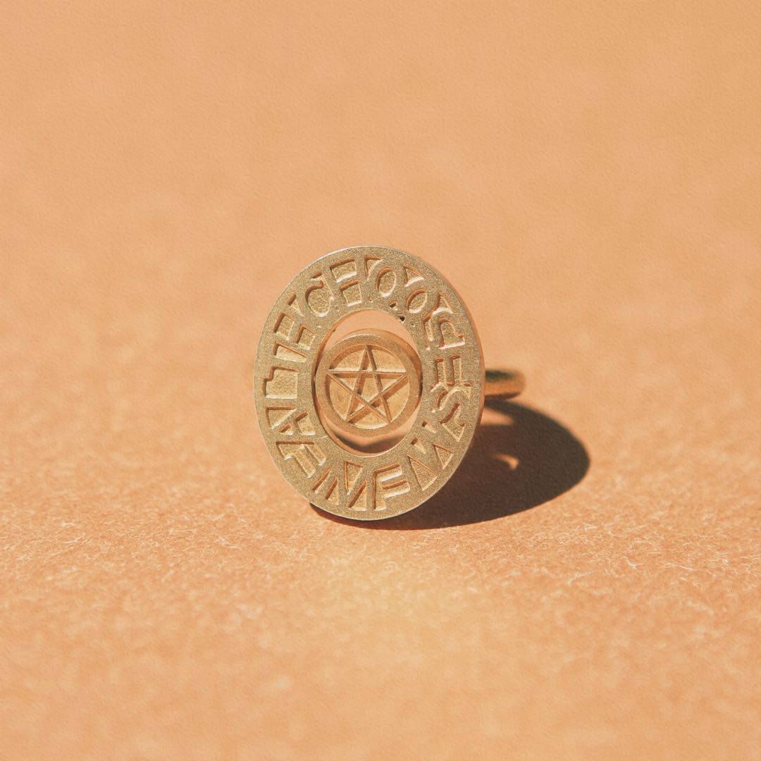 Yiru.jewellery pentacle signet ring with engraved pentagram design, silver band, and polished finish on a plain background.