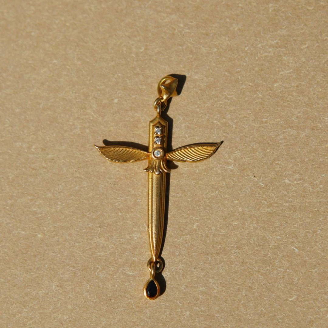 Queen of Swords Tarot pendant by yiru.jewellery featuring a detailed silver charm with tarot card design.
