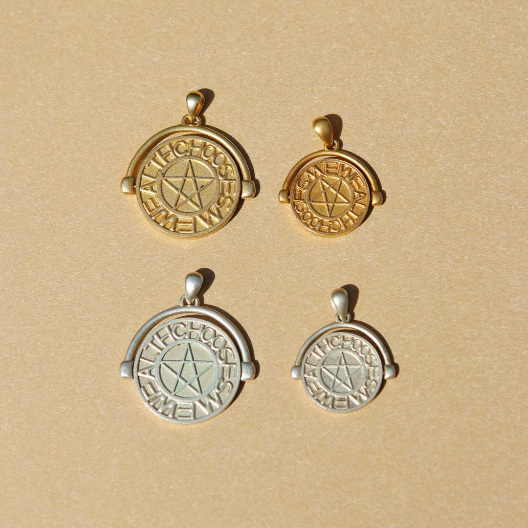 Yiru.jewellery pentacle signet pendant featuring a circular metal design with engraved pentacle symbol on a chain.
