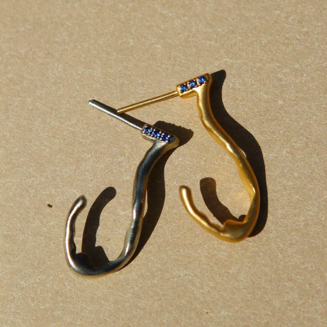 Yiru.jewellery Queen of Cups earrings featuring intricate silver design with gemstone accents, elegant jewelry for special occasions.