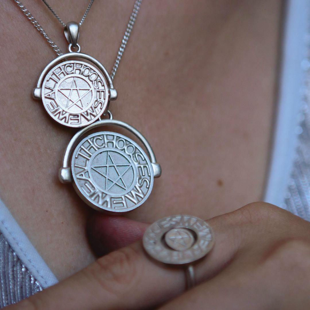 Yiru.jewellery Pentacle Signet Pendant with engraved pentagram design on polished metal surface.