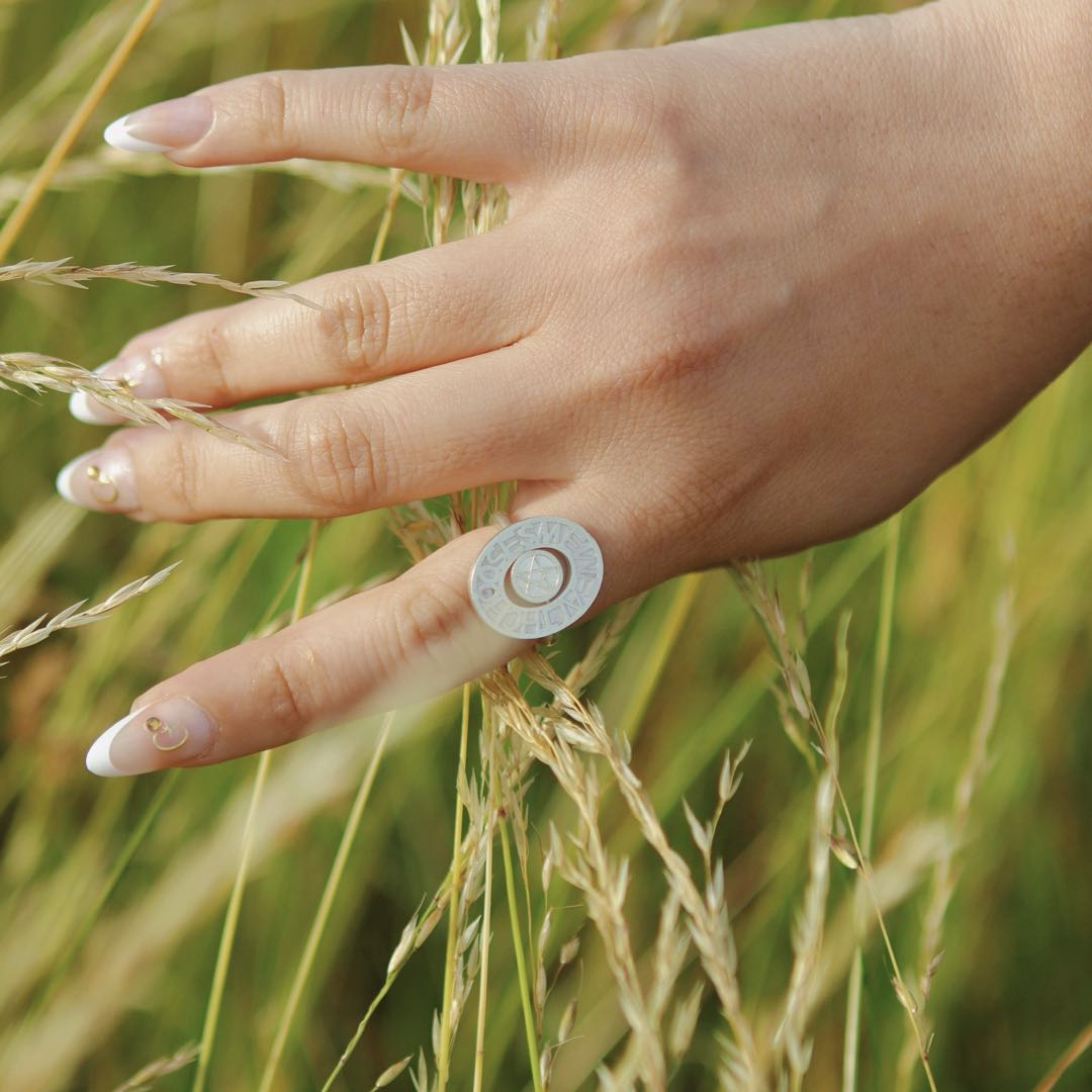 Silver pentacle signet ring by yiru.jewellery featuring a detailed pentagram design on a smooth band.