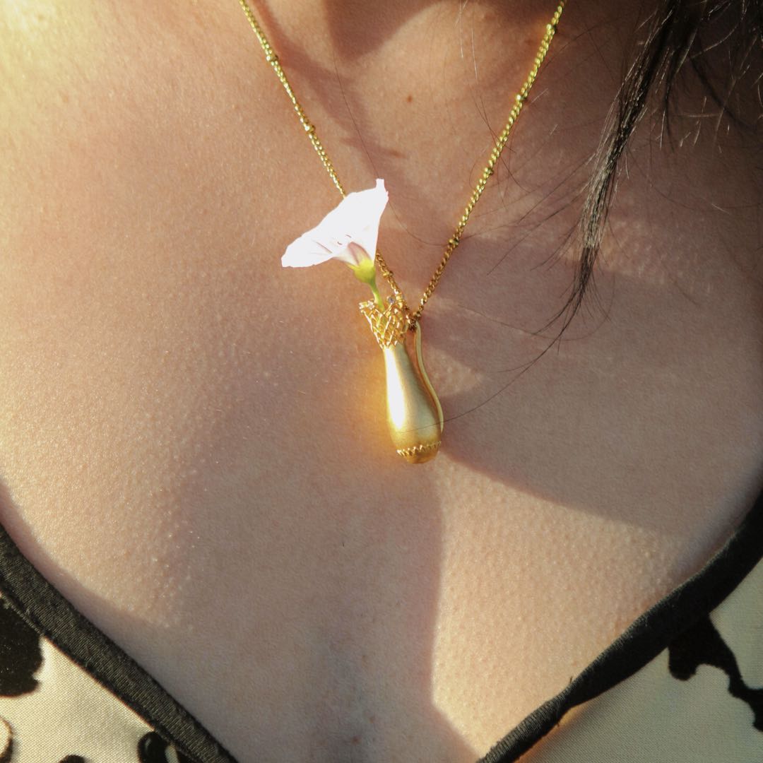 Yiru.jewellery Queen of Cups pendant featuring a detailed, elegant design with a gemstone accent on a silver chain.
