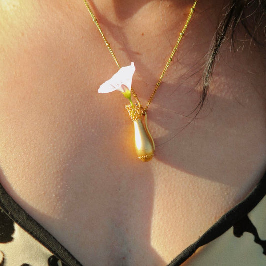 Yiru.jewellery Queen of Cups pendant featuring a detailed, elegant design with a gemstone accent on a silver chain.
