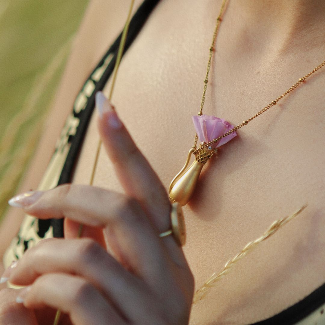 Yiru.jewellery Queen of Cups pendant featuring a detailed, artistic design in silver with gemstone accents.