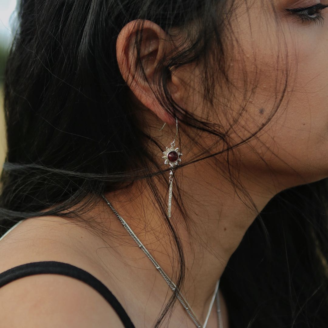 Yiru.jewellery Queen of Wands earrings featuring gold-tone design with intricate detailing and gemstone accents.