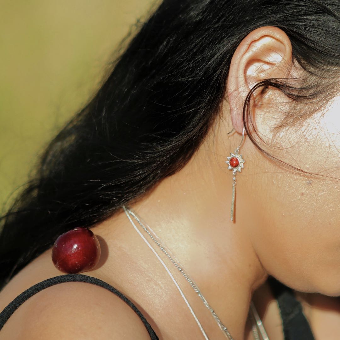Gold Queen of Wands earrings by yiru.jewellery featuring intricate design and gemstone accents, displayed on a white background.