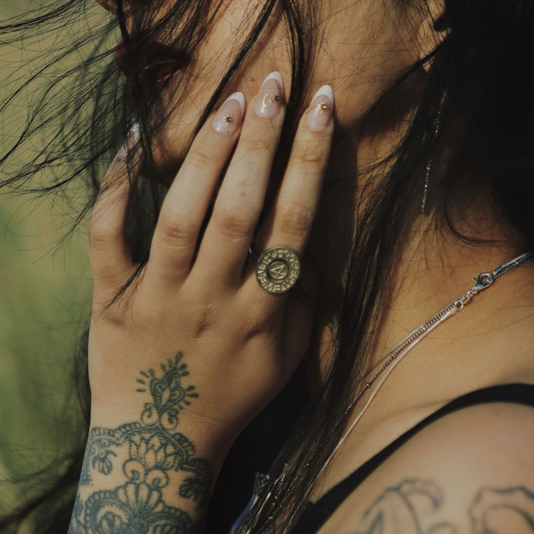 Yiru.jewellery pentacle signet ring in silver featuring a detailed pentagram design on a smooth band.