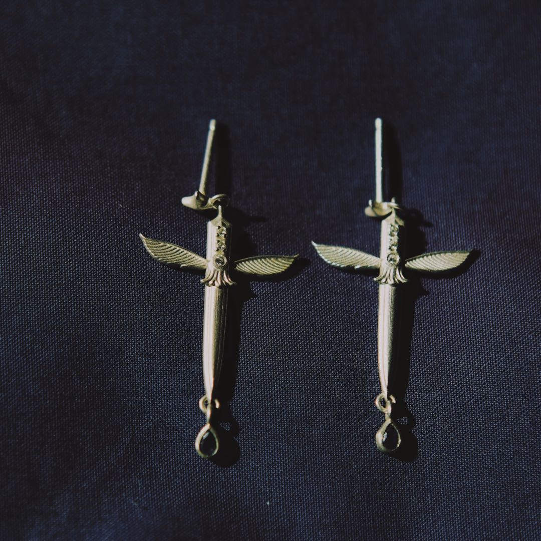 Yiru.jewellery Queen of Swords earrings featuring intricate metal design and gemstone accents, stylish dangle jewelry.