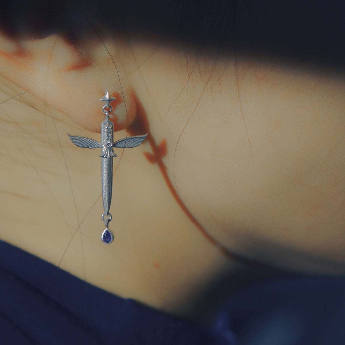 Yiru.jewellery Queen of Swords earrings with intricate silver design and gemstone accents, showcasing elegant jewelry craftsmanship.