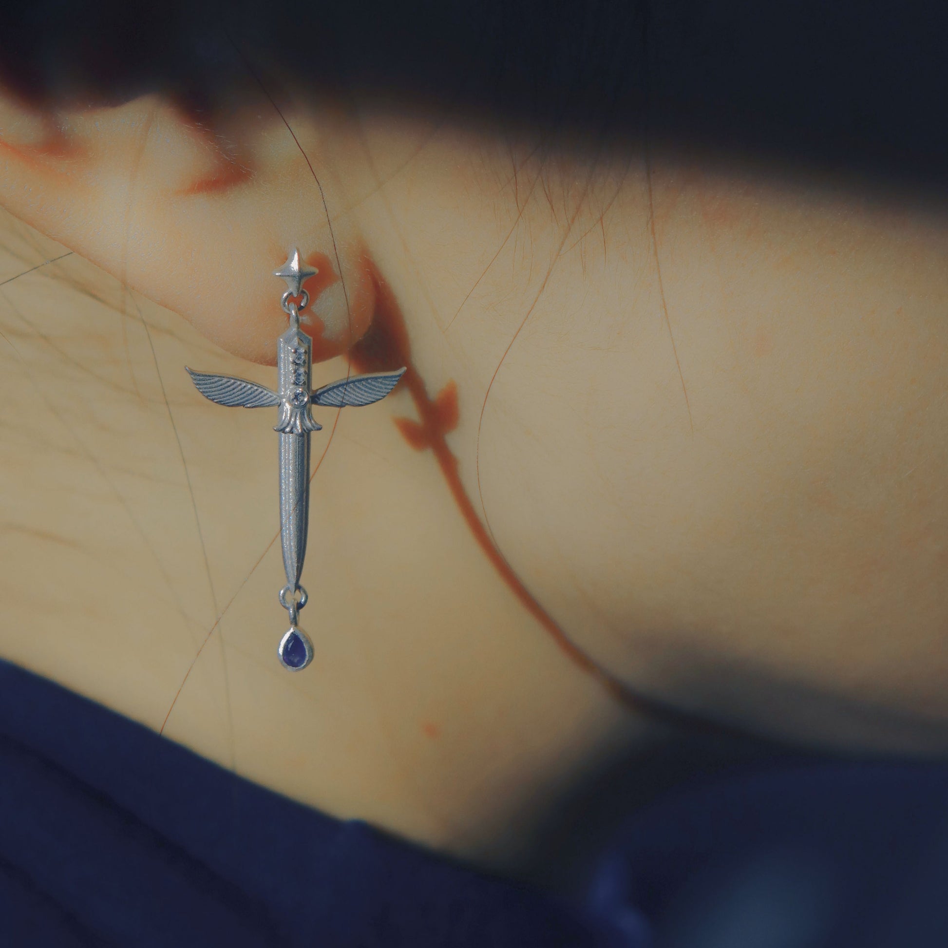 Yiru.jewellery Queen of Swords earrings with intricate silver design and gemstone accents, showcasing elegant jewelry craftsmanship.