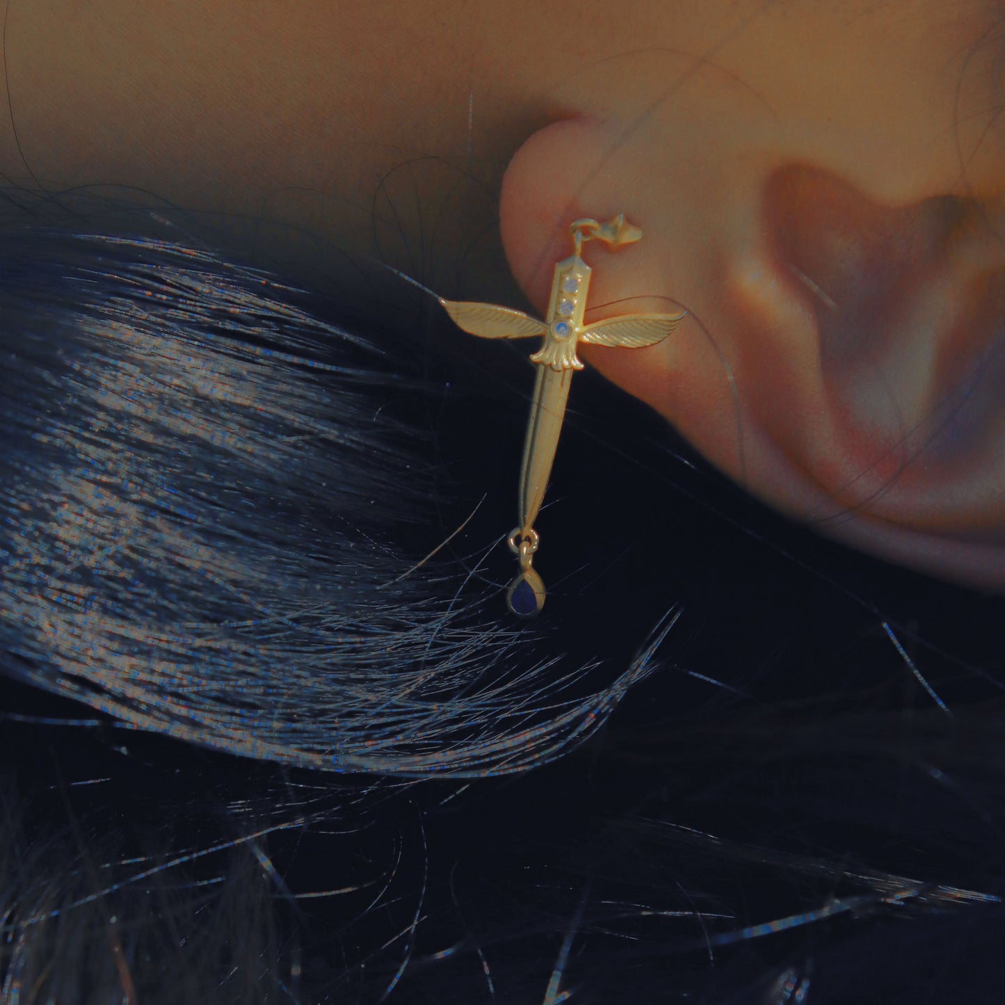 Yiru.jewellery Queen of Swords earrings featuring intricate design and silver finish, hanging earrings with detailed sword motif.