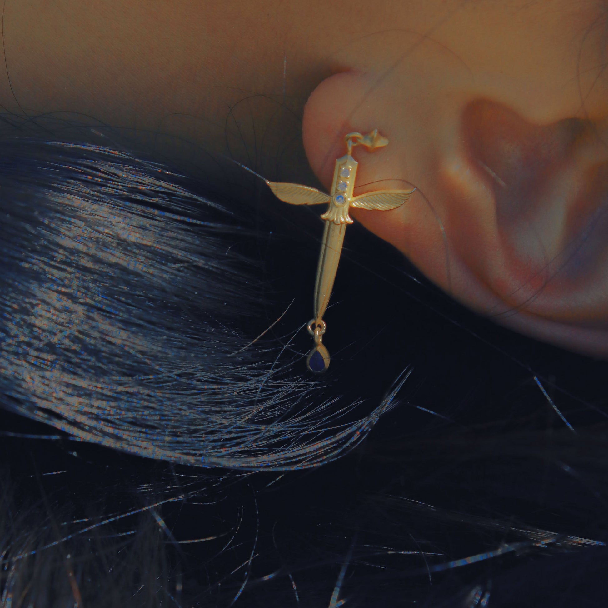 Yiru.jewellery Queen of Swords earrings featuring intricate design and silver finish, hanging earrings with detailed sword motif.