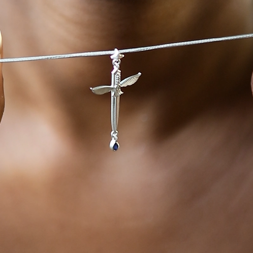 Yiru.jewellery Queen of Swords Tarot pendant featuring a detailed silver design with tarot card imagery.